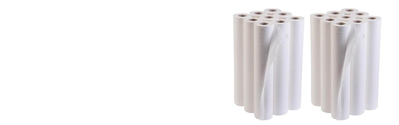 18 white rolls of disposable couch paper standing upright in 2 groups of 9 rolls shown justified to the right of a plain white background. The couch roll is highlighted in clear detail, emphasising its smooth texture and clean appearance, commonly used for covering medical or clinical examination couches.