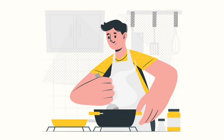 A person stirring a pan in a kitchen.