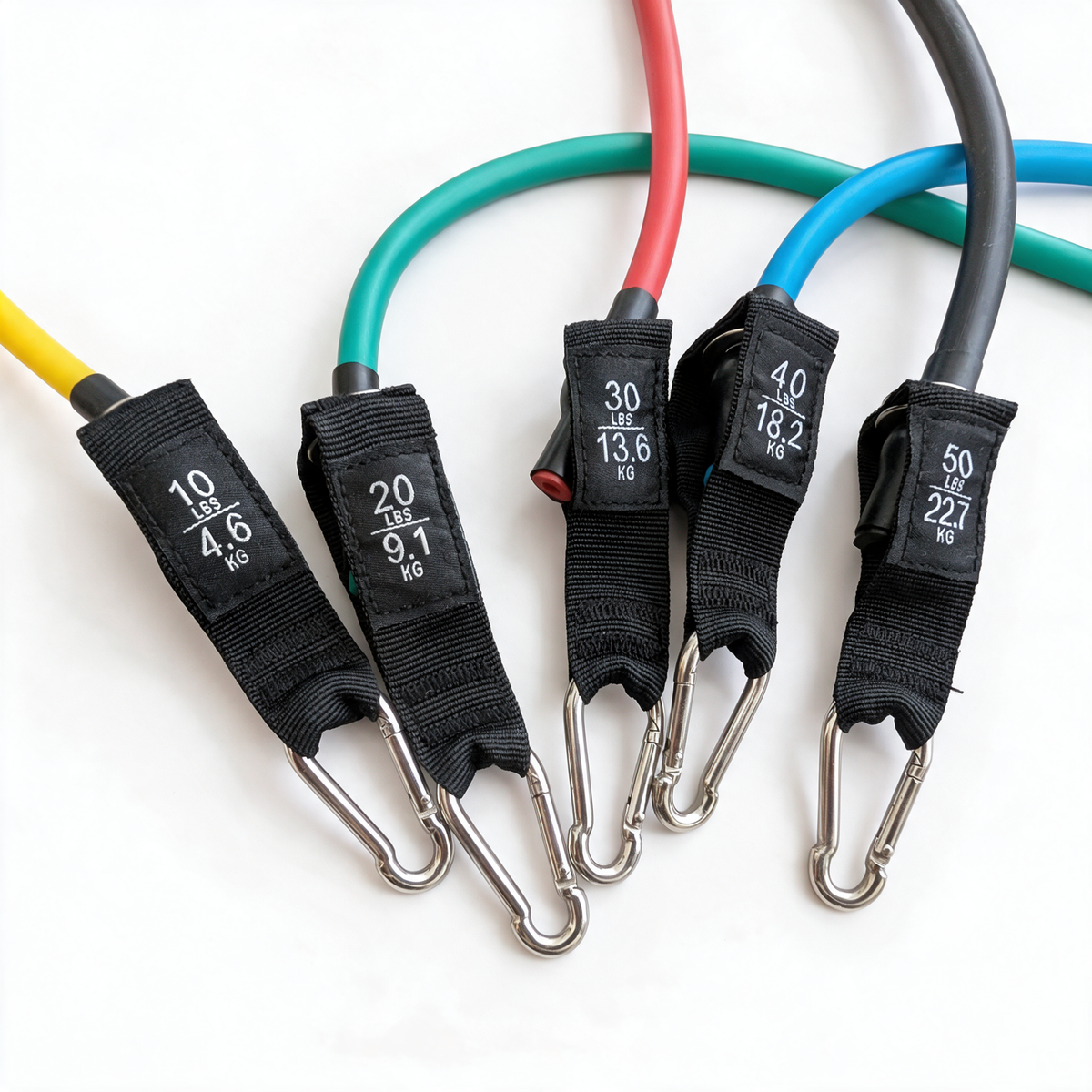 Five Meglio resistance tubes on a white background with their printed weight labels and metal clips